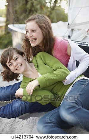 2 girls having fun at a beach View Large Photo Image Picture - 2 girls having fun at a beach. Fotosearch