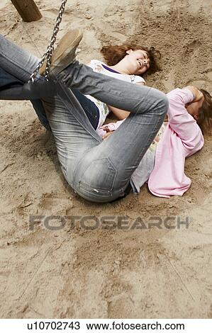 2 girls having fun together in a park View Large Photo Image Stock Image - 2 girls having fun together in a park. Fotosearch