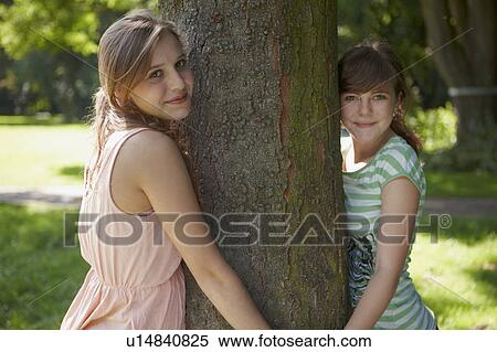 2 girls having fun together in a park View Large Photo Image Stock Photography - 2 girls having fun together in a park. Fotosearch