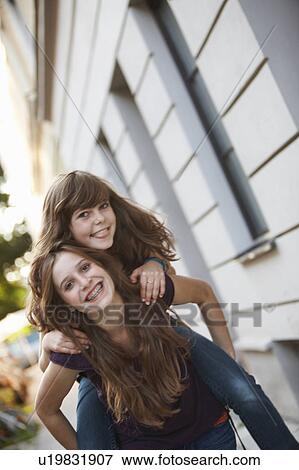 2 girls having fun together View Large Photo Image Stock Photo - 2 girls having fun together. Fotosearch