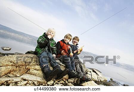 3 boys eating fruit at lake View Large Photo Image Stock Image - 3 boys eating fruit at lake. Fotosearch