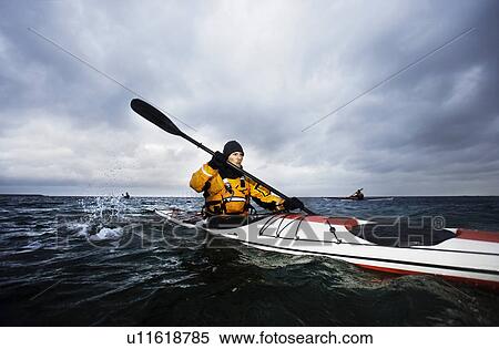 3 kaykers at see View Large Photo Image Stock Photography - 3 kaykers at see. Fotosearch