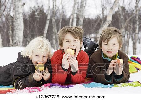 3 kids eating fruit View Large Photo Image Stock Photography - 3 kids eating fruit. Fotosearch