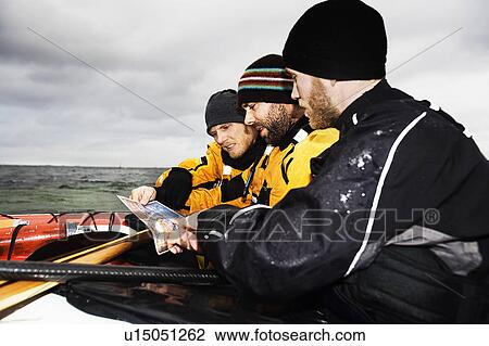 3 men looking at map View Large Photo Image Stock Image - 3 men looking at map. Fotosearch