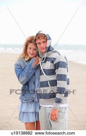 A young couple at the beach View Large Photo Image Stock Image - A young couple at the beach. Fotosearch