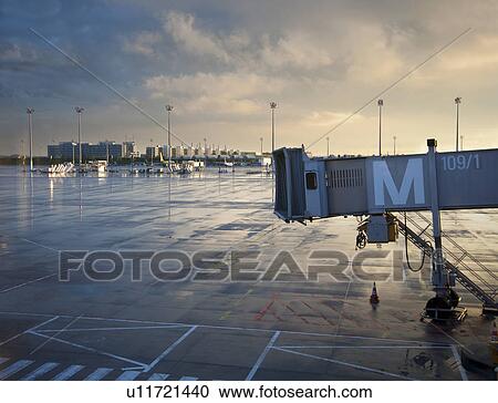 Stock Image - Aeroplane connecting boarding bridge. Fotosearch