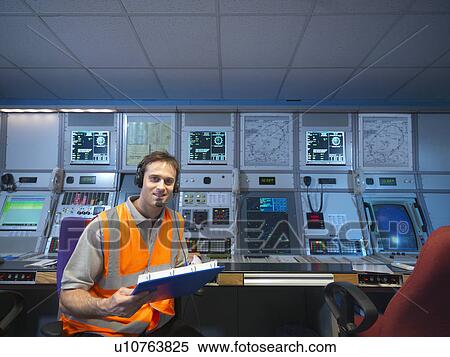 Stock Photography - Air traffic controller in radar room. Fotosearch