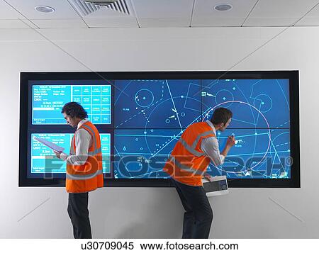 Stock Photography - Air traffic controller with simulation. Fotosearch