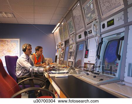 Air traffic controllers in radar room View Large Photo Image Picture - Air traffic controllers in radar room. Fotosearch
