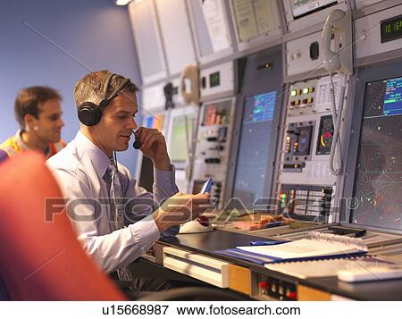 Air traffic controllers in radar room View Large Photo Image Stock Photo - Air traffic controllers in radar room. Fotosearch