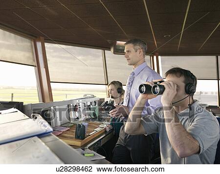 Air traffic controllers in tower View Large Photo Image Stock Image - Air traffic controllers in tower. Fotosearch