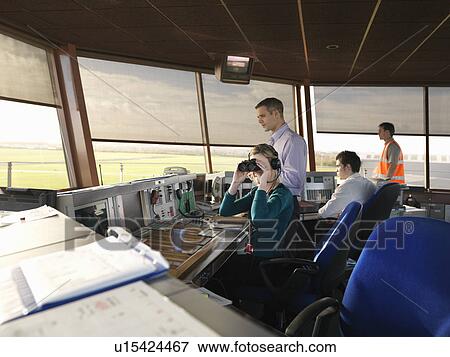 Stock Photo - Air traffic controllers in tower. Fotosearch