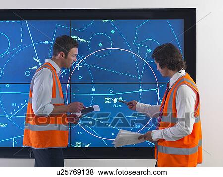 Stock Photo - Air traffic controllers with simulation. Fotosearch