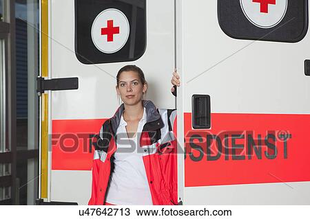 Ambulance woman in front of coach View Large Photo Image Stock Image - Ambulance woman in front of coach. Fotosearch