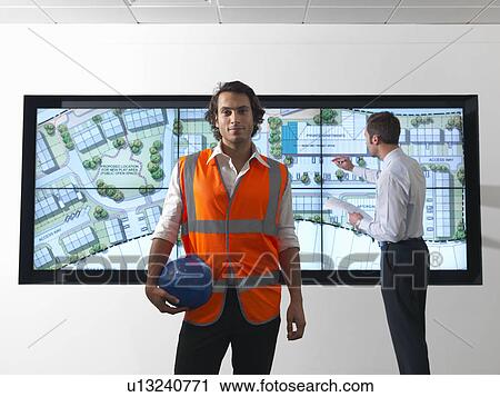 Architects in front of plans on screen View Large Photo Image Stock Image - Architects in front of plans on screen. Fotosearch