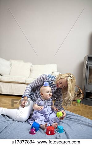Baby playing with mother View Large Photo Image Picture - Baby playing with mother. Fotosearch