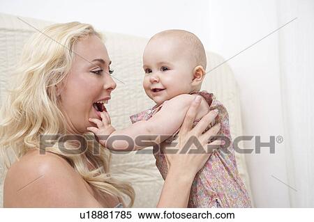 Baby with Mother in bed View Large Photo Image Stock Photography - Baby with Mother in bed. Fotosearch