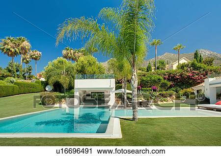 Stock Image - Beautiful pool in luxury property, Spain. Fotosearch
