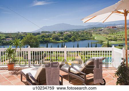 Stock Photo - Beautiful terrace in luxury property. Fotosearch