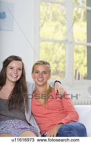 Best friends portrait sit on couch View Large Photo Image Stock Image - Best friends portrait sit on couch. Fotosearch
