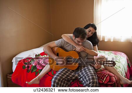 Boy and Girl on bed View Large Photo Image Stock Image - Boy and Girl on bed. Fotosearch