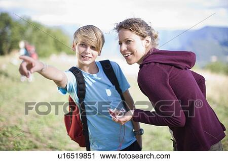 Stock Image - Boy and woman in nature. Fotosearch