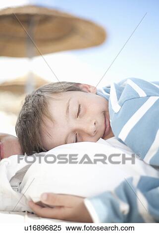 Boy asleep, lying on woman View Large Photo Image Stock Photography - Boy asleep, lying on woman. Fotosearch