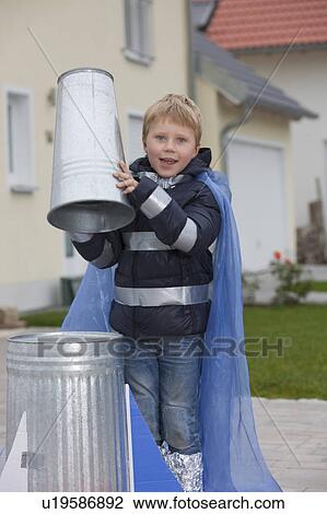 Stock Image - Boy constructing rocket. Fotosearch