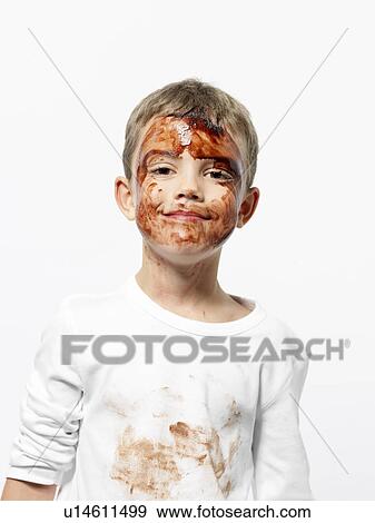Stock Photo - Boy covered in chocolate sauce. Fotosearch