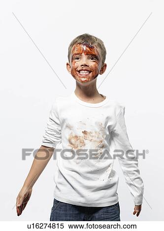 Stock Photography - Boy covered in chocolate sauce. Fotosearch