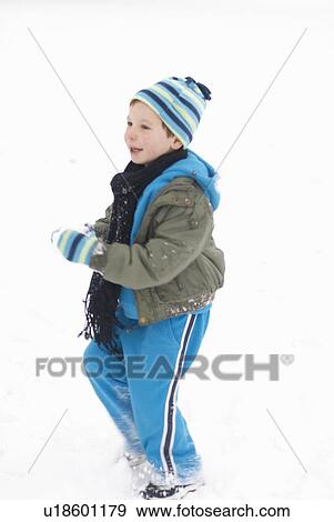 Stock Photo - Boy playing in snow. Fotosearch
