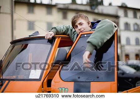 Stock Image - Boy with flossy moped. Fotosearch