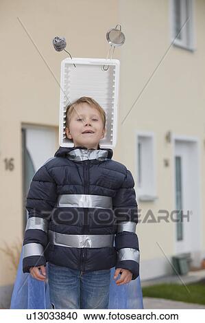 Stock Image - Boy with self constructed space hat. Fotosearch
