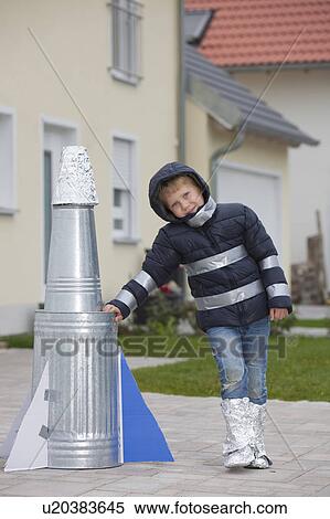 Boy with selfmade rocket, happy View Large Photo Image Stock Photography - Boy with selfmade rocket, happy. Fotosearch