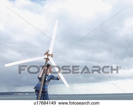 Boy with wind turbine View Large Photo Image Stock Photo - Boy with wind turbine. Fotosearch