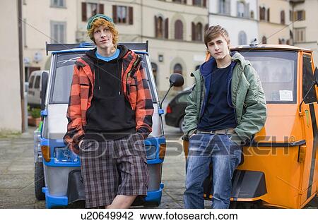 Stock Image - Boys with flossy mopeds. Fotosearch