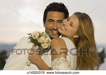 Bridal couple having fun View Large Photo Image Stock Photo - Bridal couple having fun. Fotosearch