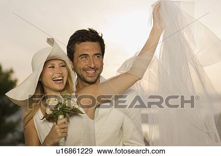 Bridal couple having fun View Large Photo Image Stock Photo - Bridal couple having fun. Fotosearch