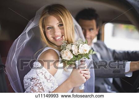 Bridal couple in car View Large Photo Image Stock Image - Bridal couple in car. Fotosearch