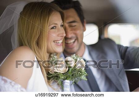 Bridal couple in car View Large Photo Image Stock Photo - Bridal couple in car. Fotosearch