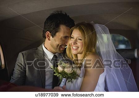 Bridal couple in car View Large Photo Image Stock Photo - Bridal couple in car. Fotosearch
