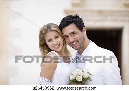 Bridal couple in front of church View Large Photo Image Stock Image - Bridal couple in front of church. Fotosearch