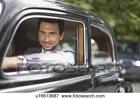 Stock Photo - Bridegroom in car. Fotosearch