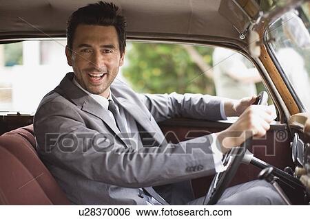 Stock Photograph - Bridegroom in car. Fotosearch