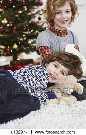 Stock Image - Brother and sister cuddling. Fotosearch