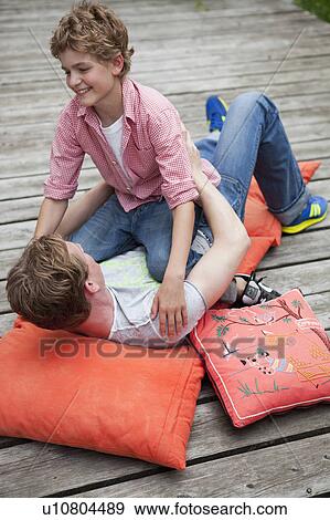 Stock Photo - Brothers at play. Fotosearch