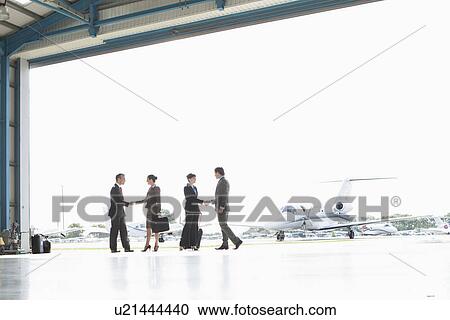 Stock Image - Business executives at airport. Fotosearch