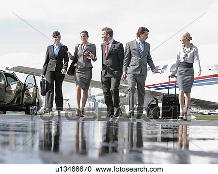 Stock Image - Business executives on the go. Fotosearch