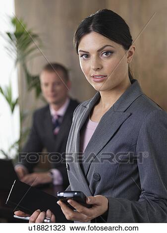 Business man and woman in office View Large Photo Image Stock Image - Business man and woman in office. Fotosearch