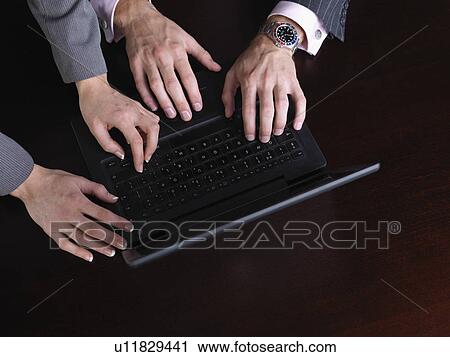 Business man and woman on computer View Large Photo Image Stock Image - Business man and woman on computer. Fotosearch